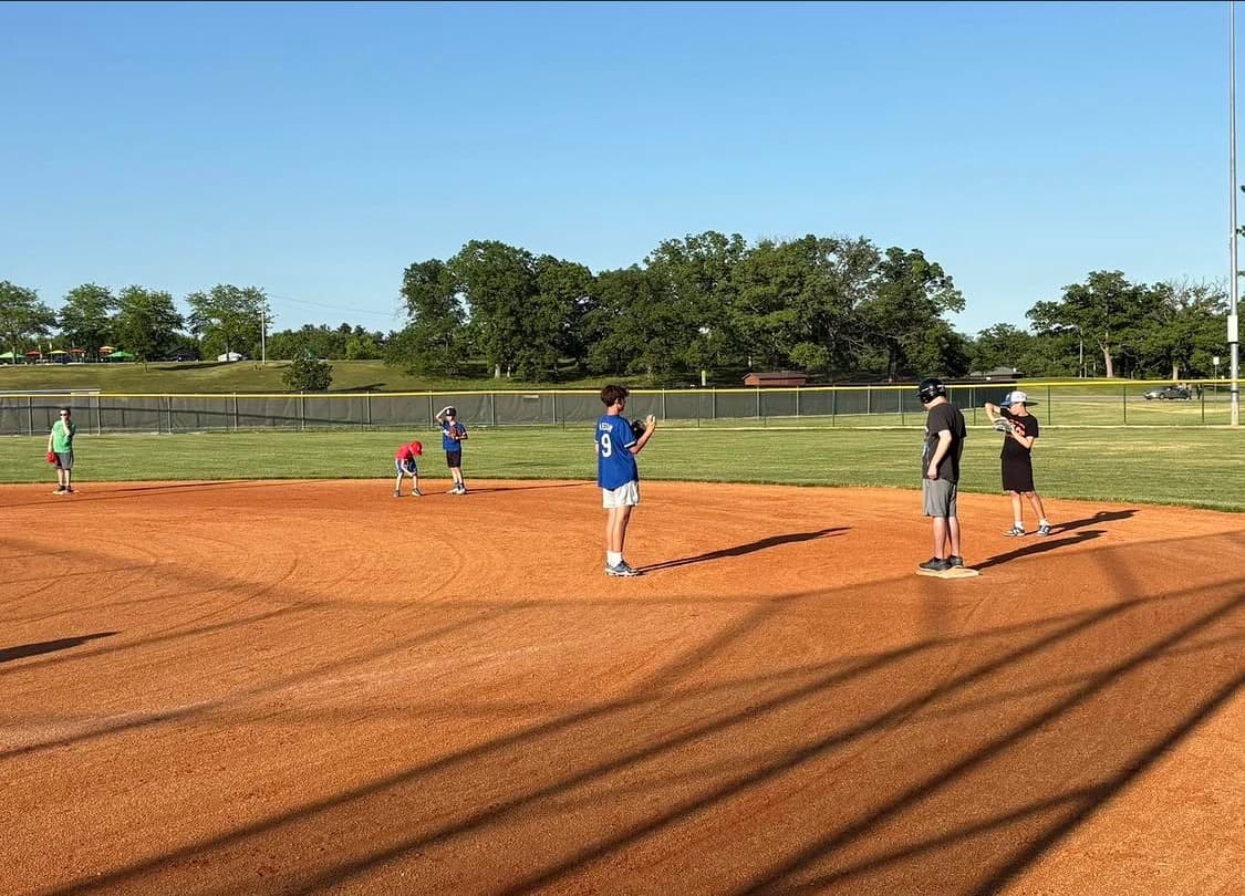 Bandits players running infield drills at practice on a sunny day